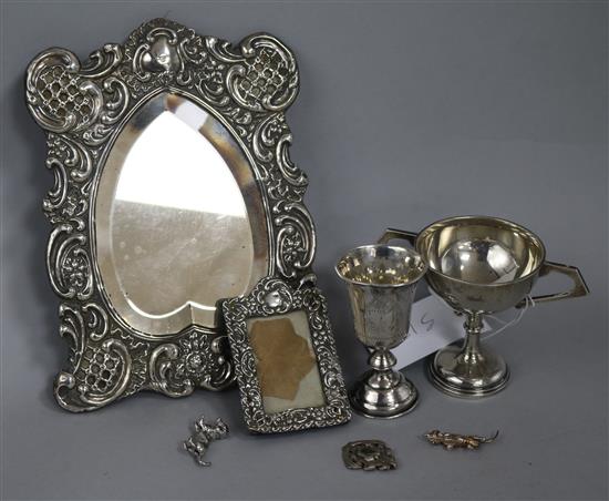 A late 19th century Russian silver kiddush cup and six other items including two silver mounted photograph frames.